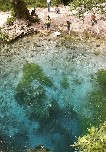 The deep-blue water of Syri i Kalter spring, Albania